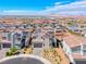 An aerial view of modern homes featuring solar panels, surrounded by desert landscaping at 1038 Delbrook Ave, Henderson, NV 89012