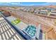 Enjoy the beautiful Las Vegas view from the backyard with a modern hot tub and a paved patio at 1038 Delbrook Ave, Henderson, NV 89012