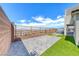 Enjoy outdoor living on the expansive paved patio with synthetic grass and mountain views beyond the fence at 1038 Delbrook Ave, Henderson, NV 89012
