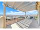 Spacious balcony features a pergola and wrought iron railing overlooking a city view at 1038 Delbrook Ave, Henderson, NV 89012