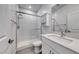 Contemporary bathroom features a glass enclosed shower and single sink vanity at 1038 Delbrook Ave, Henderson, NV 89012
