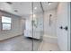 Bathroom features a glass enclosed shower and a single sink vanity at 1038 Delbrook Ave, Henderson, NV 89012