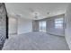 Carpeted bedroom with chandelier, walkout balcony and modern accent wall at 1038 Delbrook Ave, Henderson, NV 89012