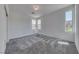Neutral bedroom with carpet, three windows and closet at 1038 Delbrook Ave, Henderson, NV 89012