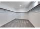 Walk-in closet with carpet flooring and wooden closet rods at 1038 Delbrook Ave, Henderson, NV 89012