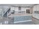 Bright kitchen boasts a large center island with decorative accents and stainless steel appliances at 1038 Delbrook Ave, Henderson, NV 89012