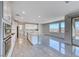 Bright kitchen with stainless steel appliances, an island with seating, and valley views at 1038 Delbrook Ave, Henderson, NV 89012