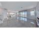 Spacious open-concept living area with tile flooring, large windows, and modern finishes at 1038 Delbrook Ave, Henderson, NV 89012