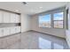 Bright Living area with white cabinets, tile flooring and large windows offering scenic views at 1038 Delbrook Ave, Henderson, NV 89012