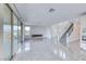 Open living space featuring tile floors, sliding glass doors, a modern fireplace, and staircase at 1038 Delbrook Ave, Henderson, NV 89012