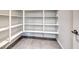 Walk-in pantry features ample shelving and a tiled floor at 1038 Delbrook Ave, Henderson, NV 89012