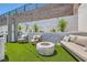 Backyard gathering place with a modern seating area, complete with a stylish fire pit for cozy outdoor relaxation at 11912 Skyline Arch Ct, Las Vegas, NV 89138