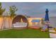 The backyard provides a luxurious daybed seating area, designed for ultimate relaxation and outdoor enjoyment at 11912 Skyline Arch Ct, Las Vegas, NV 89138