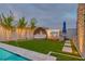 Backyard featuring a relaxing daybed with a view of the pool, and modern landscaping for a tranquil retreat at 11912 Skyline Arch Ct, Las Vegas, NV 89138