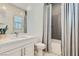 Modern bathroom featuring a stylish vanity, tiled floor, and shower-tub combination at 11912 Skyline Arch Ct, Las Vegas, NV 89138