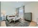 Bright bedroom with neutral tones, stylish furnishings, and natural light at 11912 Skyline Arch Ct, Las Vegas, NV 89138
