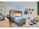 Bright bedroom with bunk bed, tennis themed decor, and a comfortable study area at 11912 Skyline Arch Ct, Las Vegas, NV 89138