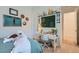 Well-lit bedroom with tennis themed decor and desk near open doorway at 11912 Skyline Arch Ct, Las Vegas, NV 89138