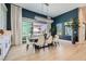Elegant dining room with a modern chandelier and access to the outdoor space at 11912 Skyline Arch Ct, Las Vegas, NV 89138