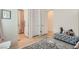 Hallway featuring modern doors, wood floors, and a stylish ottoman at 11912 Skyline Arch Ct, Las Vegas, NV 89138