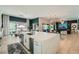 Gourmet kitchen with a large island seamlessly connects to the dining and living spaces at 11912 Skyline Arch Ct, Las Vegas, NV 89138