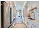 Galley kitchen with stainless steel appliances and crisp white cabinets at 11912 Skyline Arch Ct, Las Vegas, NV 89138