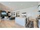 Open-concept kitchen with a large island flows into a cozy living area at 11912 Skyline Arch Ct, Las Vegas, NV 89138