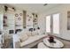 Bright living room featuring modern decor, custom built-ins, and stylish furniture at 11912 Skyline Arch Ct, Las Vegas, NV 89138