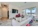 Cozy living area with a comfortable sofa, large windows, and playful decor at 11912 Skyline Arch Ct, Las Vegas, NV 89138