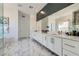 Beautiful main bathroom features dual sinks, white marble, and modern fixtures at 11912 Skyline Arch Ct, Las Vegas, NV 89138