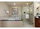 Spa-like bathroom with glass enclosed shower and soaking tub at 135 E Harmon Ave # 3816, Las Vegas, NV 89109