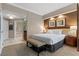 Comfortable and neutral main bedroom with king bed, ensuite and dark wood accent wall at 135 E Harmon Ave # 3816, Las Vegas, NV 89109