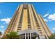 Eye-level view of gold and cream colored high rise exterior showcasing its architectural design and balconies at 135 E Harmon Ave # 3816, Las Vegas, NV 89109