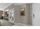 View of a hallway with a painting and a partial view of a kitchen area at 135 E Harmon Ave # 3816, Las Vegas, NV 89109