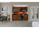 Kitchenette area with wooden cabinetry, stainless steel microwave and mini-fridge at 135 E Harmon Ave # 3816, Las Vegas, NV 89109