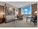 Comfortable living space featuring a sofa, chairs, and a large window showcasing the expansive Las Vegas valley at 135 E Harmon Ave # 3816, Las Vegas, NV 89109
