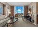 Living room area with comfortable seating, table and chairs, and a beautiful view of the Las Vegas valley at 135 E Harmon Ave # 3816, Las Vegas, NV 89109