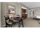 Comfortable seating area with a dark wood table next to a kitchenette at 135 E Harmon Ave # 3816, Las Vegas, NV 89109