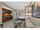 Comfortable living area with plush seating, wet bar, and room divider to sleeping area at 135 E Harmon Ave # 3816, Las Vegas, NV 89109