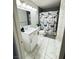 Bright bathroom showcasing a modern vanity and charming Paris-themed shower curtain at 1505 Lilac Breeze Cir, Las Vegas, NV 89108