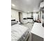 Cozy bedroom featuring an efficient kitchenette for convenient living at 1505 Lilac Breeze Cir, Las Vegas, NV 89108