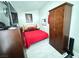Cozy bedroom with a full bed, wooden dresser, and closet, offering a comfortable space at 1505 Lilac Breeze Cir, Las Vegas, NV 89108
