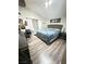 Inviting bedroom with hardwood flooring, neutral paint, and comfortable sleeping space at 1505 Lilac Breeze Cir, Las Vegas, NV 89108