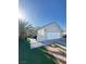 Charming single-story home with desert landscaping, a spacious driveway, and a two-car garage at 1505 Lilac Breeze Cir, Las Vegas, NV 89108