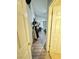 Hallway leads into a bedroom with hardwood flooring, natural lighting, and neutral tones at 1505 Lilac Breeze Cir, Las Vegas, NV 89108