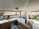 Outdoor kitchen with light countertops, cabinets, and a picturesque view of the backyard at 1505 Lilac Breeze Cir, Las Vegas, NV 89108