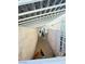 Narrow outdoor space features white metal awning, light colored walls, and view of dog at 1505 Lilac Breeze Cir, Las Vegas, NV 89108