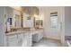 Bright bathroom with dual vanities, modern fixtures, and ample counter space, offering convenience and style at 1869 Bronze Patina St, Henderson, NV 89044