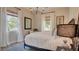Cozy bedroom with a comfortable bed, soft lighting, and windows offering natural light at 1869 Bronze Patina St, Henderson, NV 89044