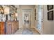 Inviting entryway with decorative console table, stylish mirror, and elegant front door design at 1869 Bronze Patina St, Henderson, NV 89044